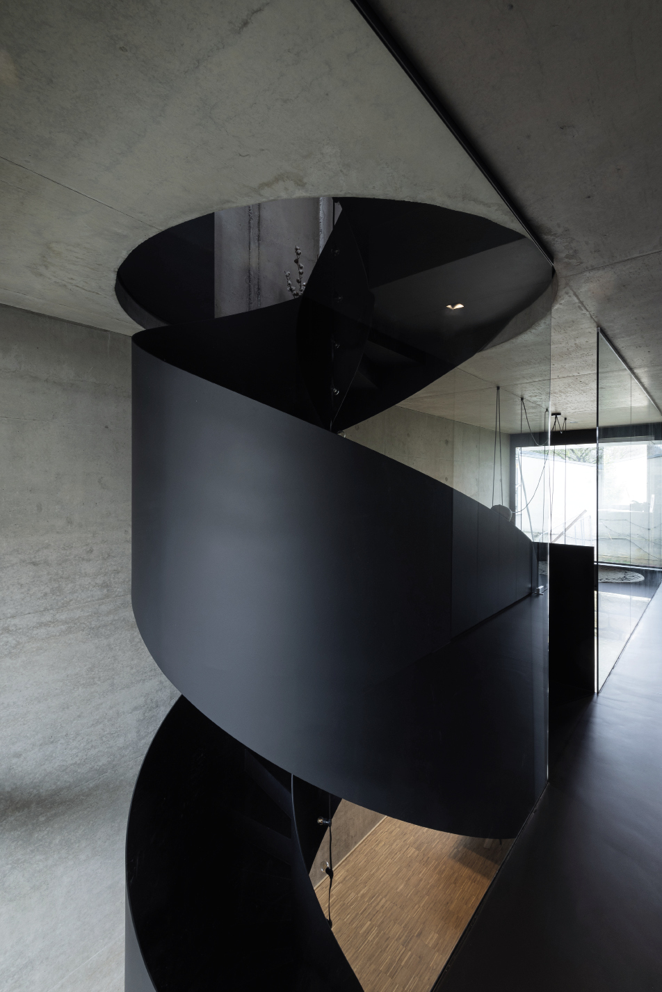 NICBIE: Like a screw, the circular stairs bind the 4 floors and their very different functional and spatial conditions. 2001 S.à R.L.